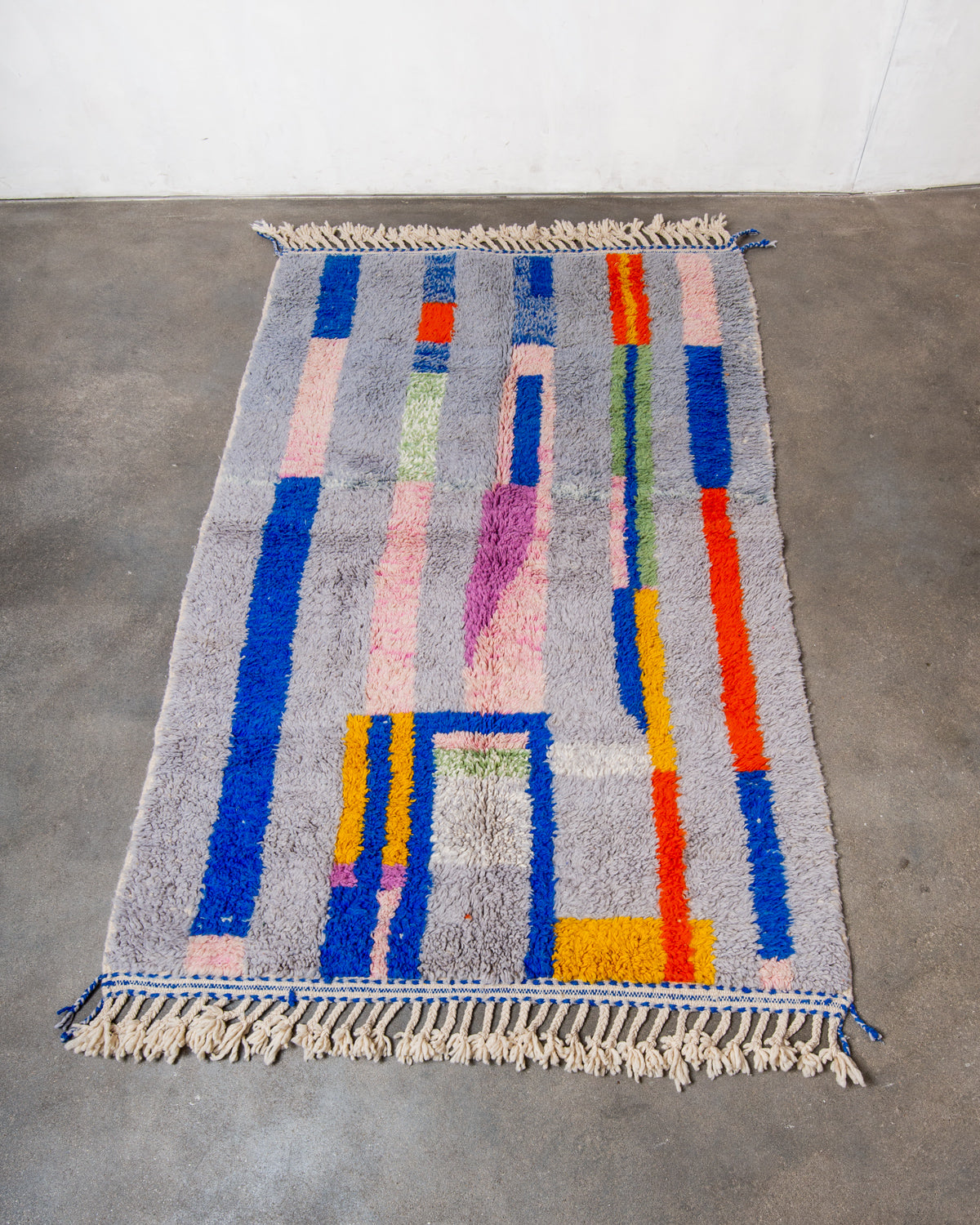 Modern, designer, handcrafted Berber rug from Morocco. Beniourain carpet with beautiful colours and patterns and fluffy wool texture.